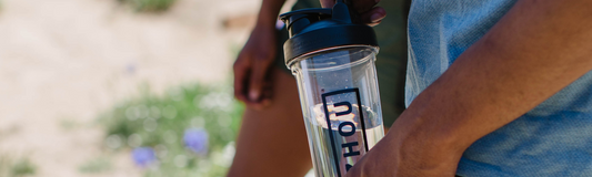 Man carrying Zhou water bottle outdoors